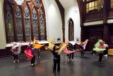 Belly dance class students using veils